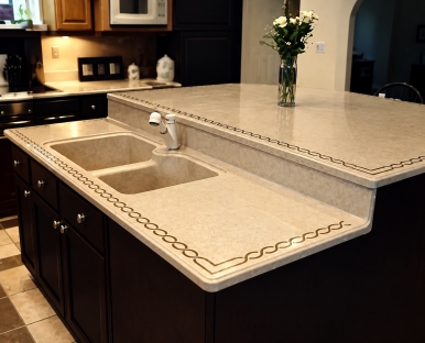 Denyx solid surface island countertop with integral sink and designer stripe